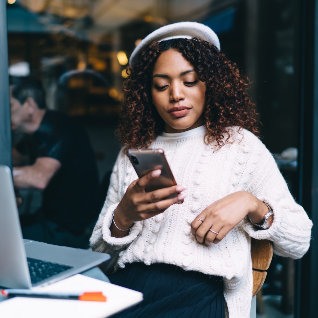 A woman looking at a phone